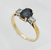 An 18ct yellow gold sapphire and diamond ring, size N.