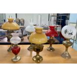 A collection of six oil lamps.