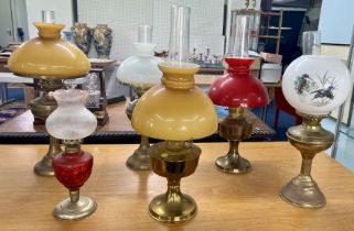 A collection of six oil lamps.