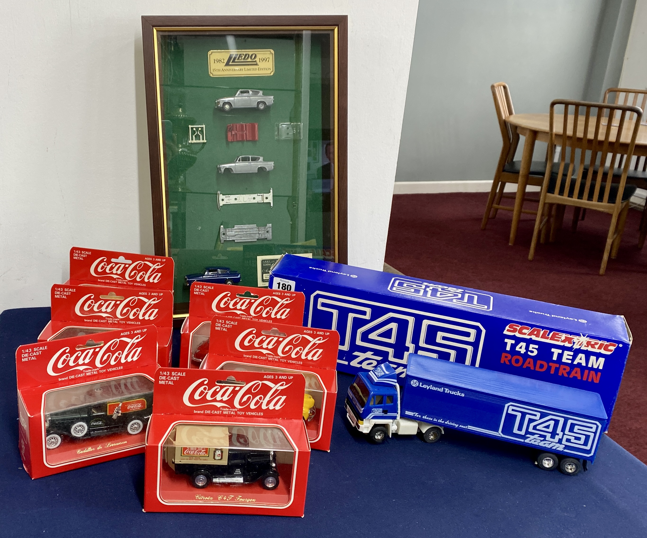 A collection of various items. Scalextric T45 Team Roadtrain Leyland Trucks, six Coco-Cola die-