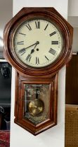 A Victorian mahogany cased drop dial wall clock, with pendulum and key, the glass door marked '