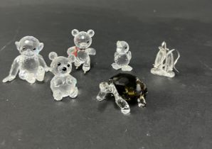 Swarovski Crystal Glass, six pieces including Chimp, Kris Bear on Skates, 2010 Event Galapagos
