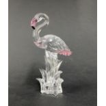 Swarovski Crystal Glass, 'Flamingo stood in grass' with green eyes, a pink beak and pink feathers,