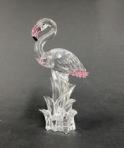 Swarovski Crystal Glass, 'Flamingo stood in grass' with green eyes, a pink beak and pink feathers,