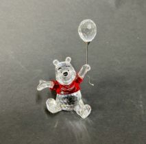 Swarovski Crystal Glass, 'Pooh' with balloon and red jumper, boxed.