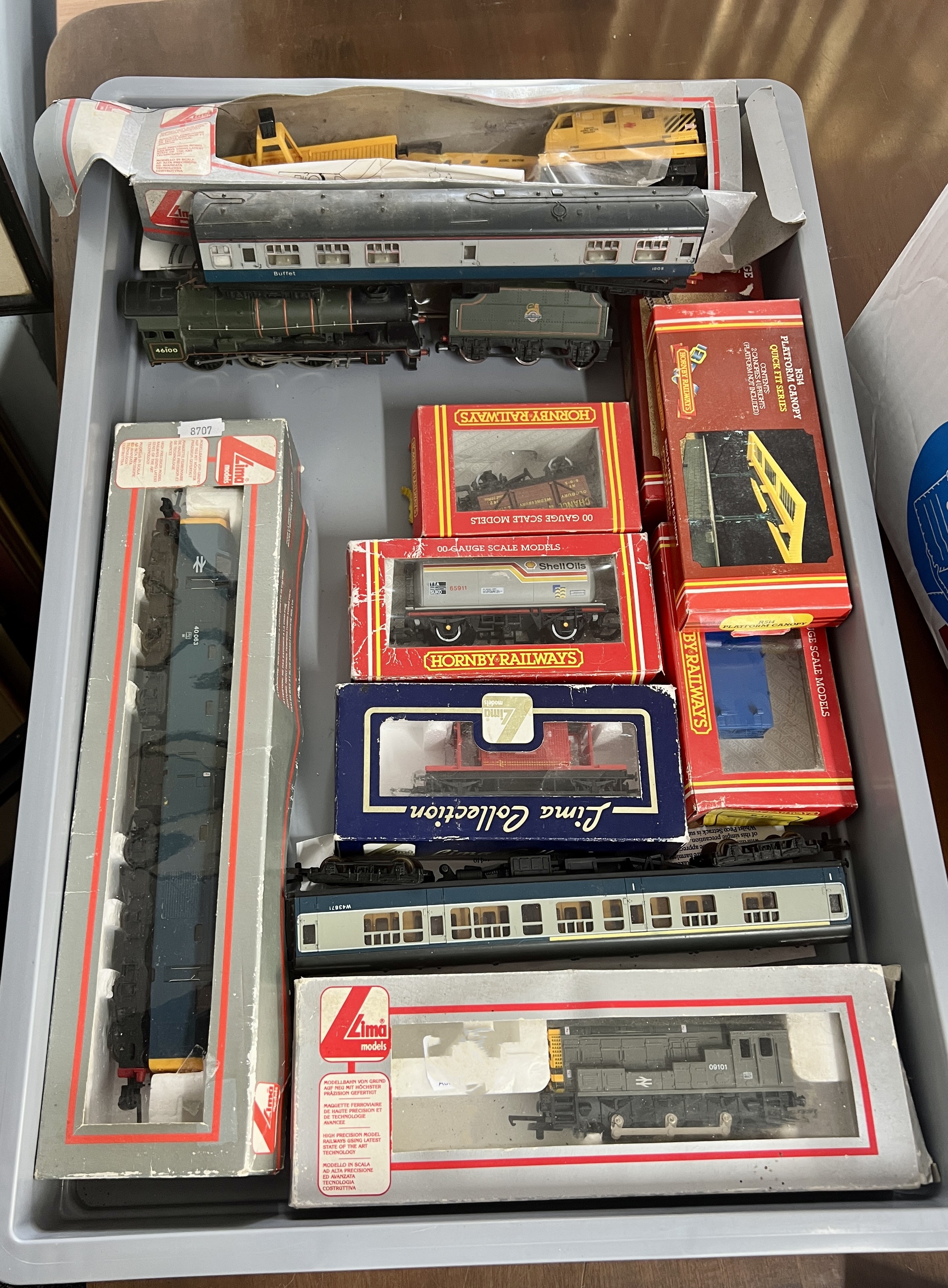 A collection of model railway including Mainline loco and tender, boxed Hornby wagons