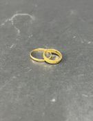 A 22ct gold wedding band ring, approx. 3.66g together with another possible 22ct gold wedding band