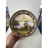 Noritake, Japanese porcelain comport on stand the bowl decorated with a landscape river scene with