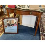 Antique mahogany side table fitted with a drawer, serpentine and a mahogany framed wall mirror