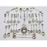 A collection of Hong Kong sterling and other silver and white metal fancy teaspoons, also a tea
