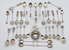 A collection of Hong Kong sterling and other silver and white metal fancy teaspoons, also a tea