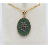 A jade style Chinese pendant on gilt chain