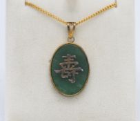 A jade style Chinese pendant on gilt chain