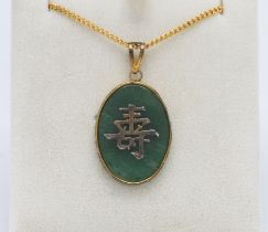 A jade style Chinese pendant on gilt chain