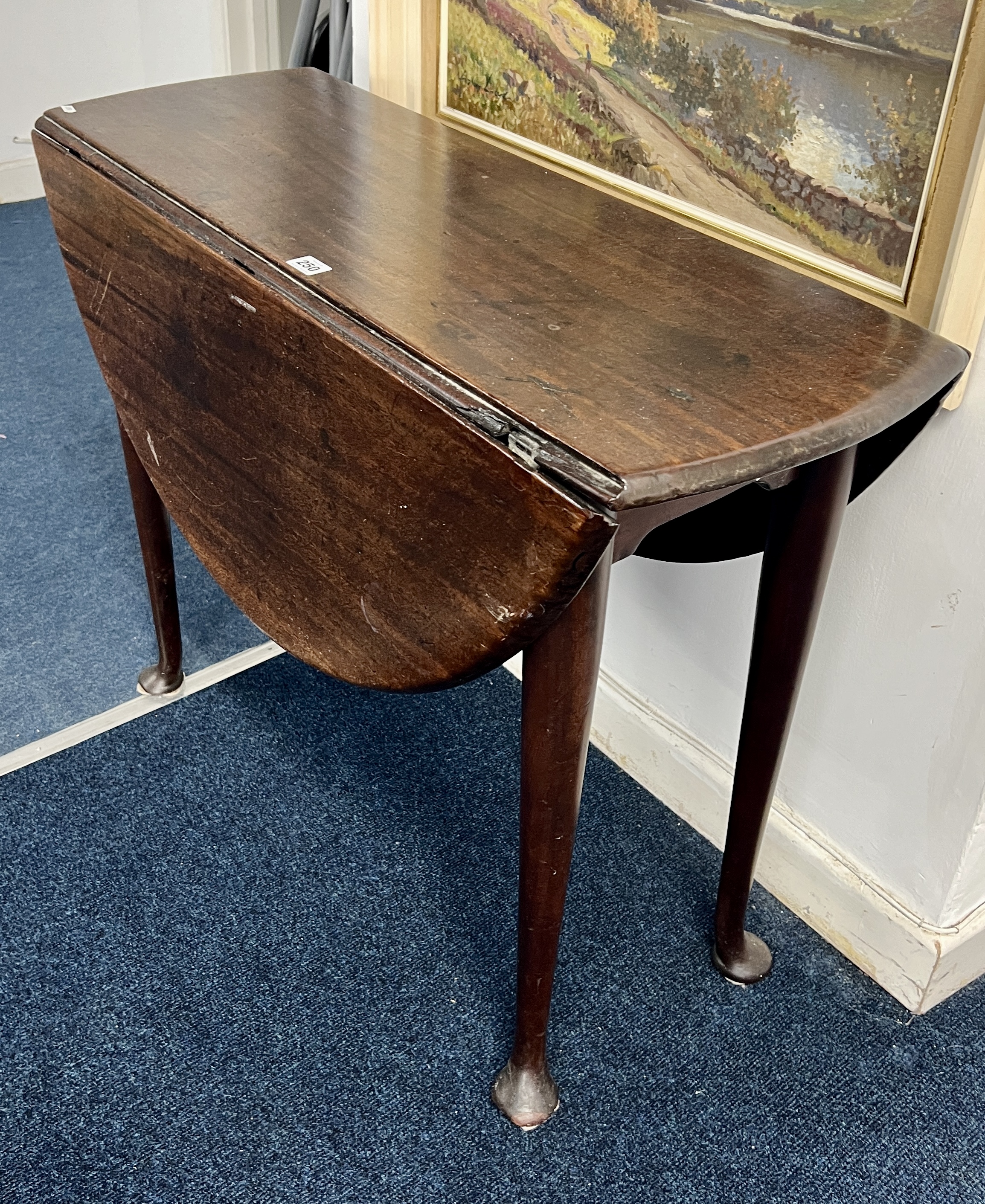 A George III mahogany drop flap table on pad feet. Length 90 cm