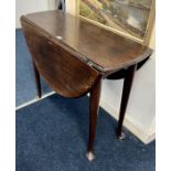 A George III mahogany drop flap table on pad feet. Length 90 cm