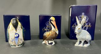 Royal Crown Derby, 'Penguin and Baby' gold stopper, 'Brown Pelican' gold stopper and 'Starlight
