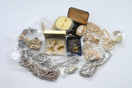 An assortment of various costume jewellery, including pearl necklaces, GP cameo, cufflinks etc