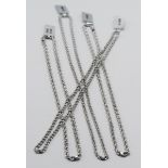 Four 9ct white gold chains, approx. 28.18g.