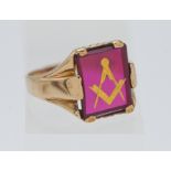 of Masonic interest, a 9 carat gents ring, with synthetic ruby and masonic symbol. 5.50 grams.