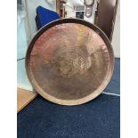 A large early 20th century circular copper tray, 78cm diameter