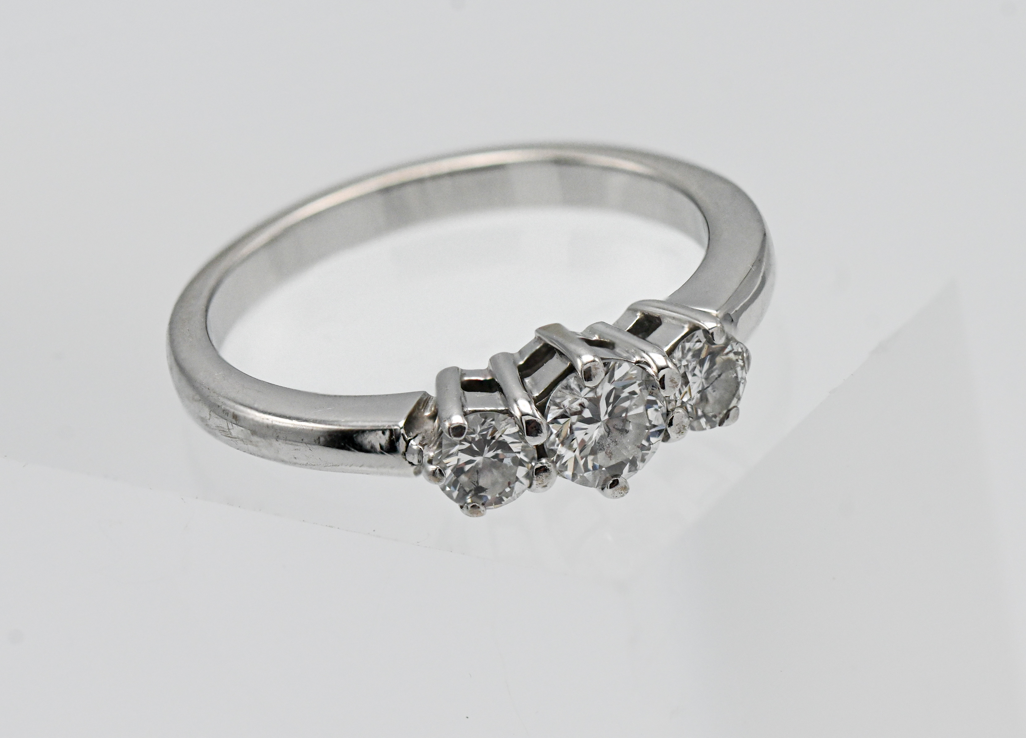 An 18ct white gold graduated 3-stone diamond ring, diamond sizes approx.: 1 x 4.05mm x 2.72 = 0.
