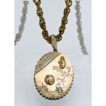A silver gilt pendant lined with a mirror, on guilt rope twist chain with landscape and inset