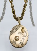 A silver gilt pendant lined with a mirror, on guilt rope twist chain with landscape and inset