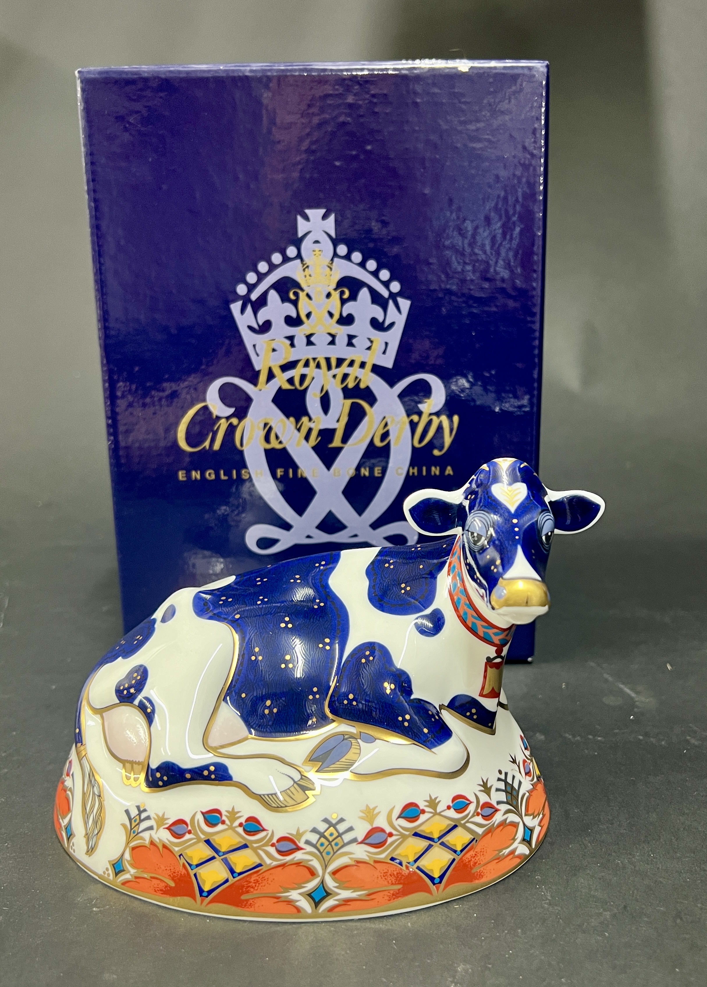 Royal Crown Derby, 'Friesian Cow, Buttercup' with gold stopper, boxed.