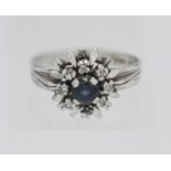 An 18 carat white gold sapphire and diamond cluster ring marked CV & Company approx. 4.5 grams