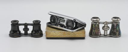 Two pairs of opera glasses, and a set of folding binoculars