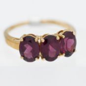 Gemporia, a 9k yellow gold Niassa Garnet ring, size S, with certificate of authenticity.