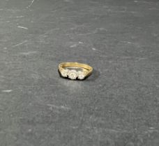 An 18ct yellow gold three stone diamond ring, size K.