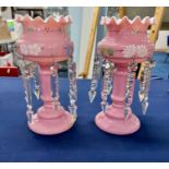 A pair of pink glass vases with glass drops, height 26cm with extra drops (one base damaged).