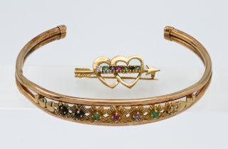 A 9 carat and coloured stone set 'slave' bangle together with a 9 carat double heart and stone set