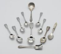 A sterling silver long handled and scalloped caddy spoon, an assortment of silver teaspoons etc.