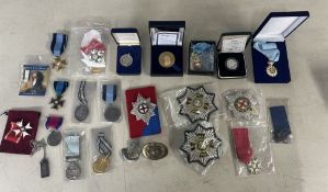 A mixed collection of military badges, reproduction medals, cloth badges, Royal Mint 1996 Silver