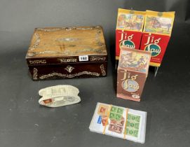 Victorian rosewood and inlaid box, three early Satona container jigsaws by Waddington's, a crested