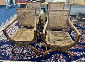 A group of four Regency style X frame chairs.