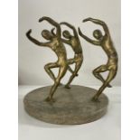 An interesting sculpture on marble base of three dancing figures, signed Lowdon? Diameter 22cm