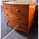 A Victorian mahogany bow-fronted chest of drawers, fitted with two long and two short splayed