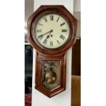 A Victorian mahogany cased drop dial wall clock, with pendulum and key, the glass door marked '