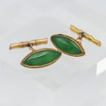 A pair of green jade? Yellow metal cufflinks. Indistinct marks with faux bamboo fittings