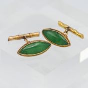 A pair of green jade? Yellow metal cufflinks. Indistinct marks with faux bamboo fittings