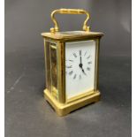 A French carriage clock with platform escapement and key, 16cm (handle up)