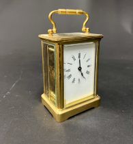 A French carriage clock with platform escapement and key, 16cm (handle up)