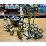 A collection of silver plated wares including a silver and glass sugar caster.