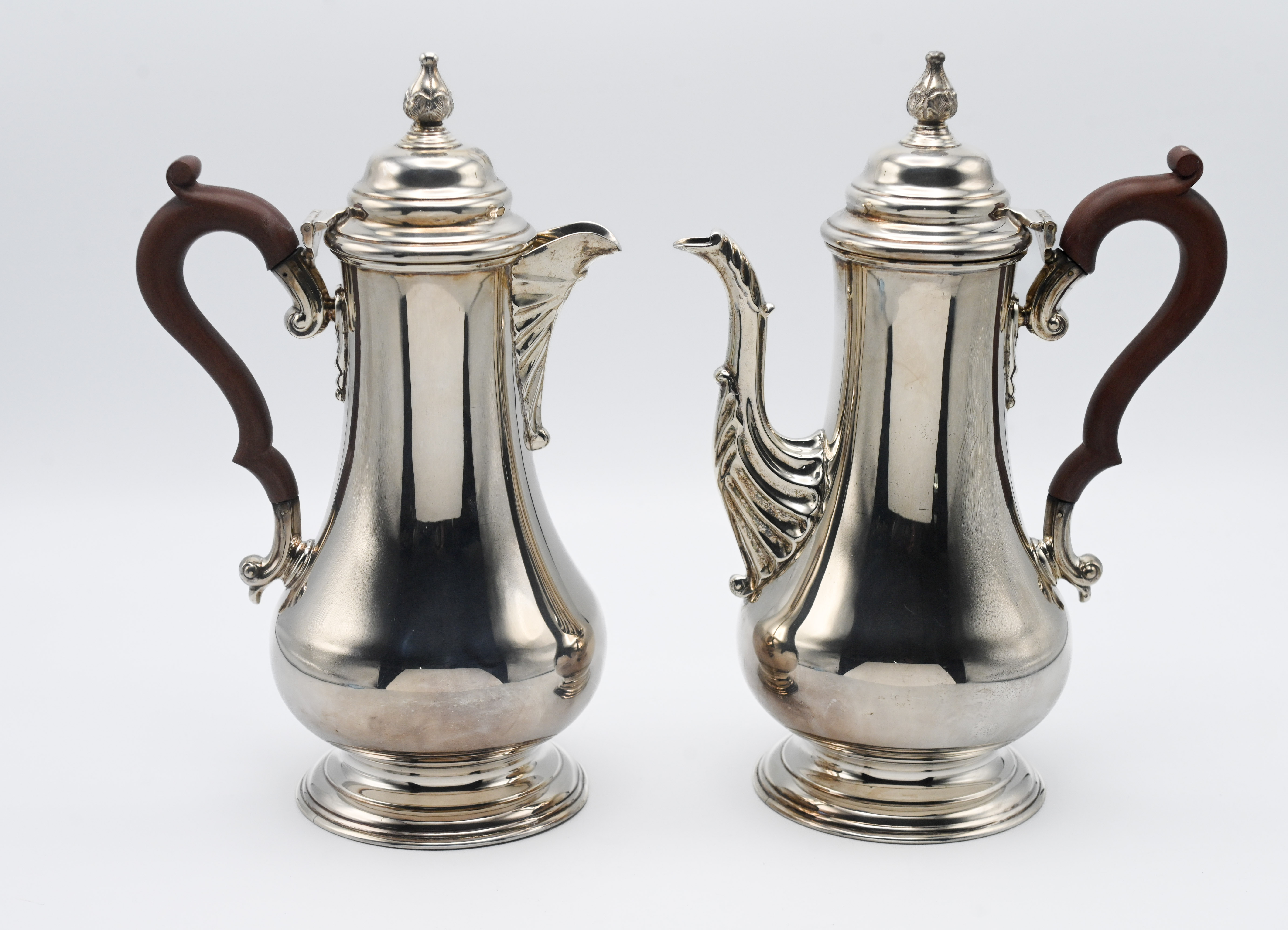 A pair of modern silver coffee and hot water pots. Birmingham circa 1973, mark for JBC & S Ltd. 28cm
