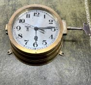 A WWII Third Reich Nazi German Kriegsmarine U-boat bulkhead clock with key, No10737, 20cm diameter.