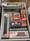 A collection of model railway including Mainline loco and tender, boxed Hornby wagons also Lima